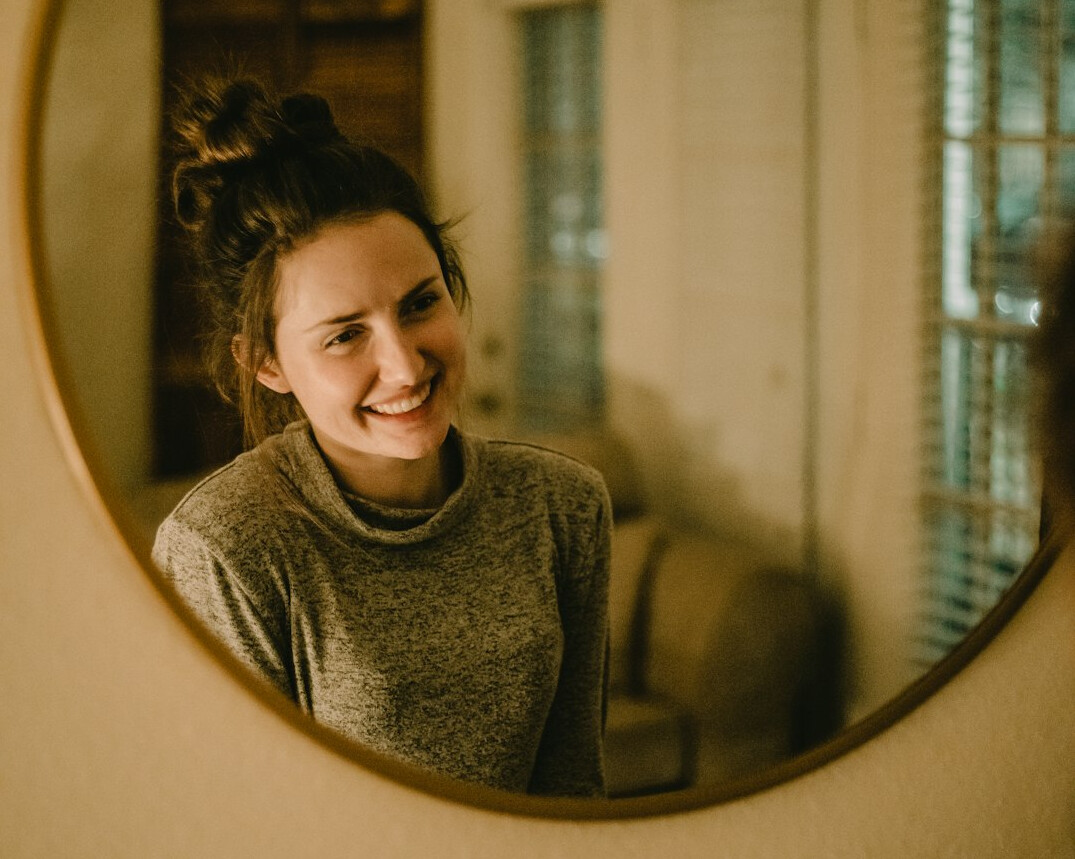 woman practicing speech in mirror